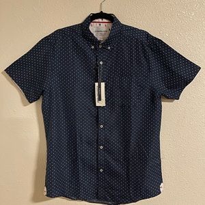 Blue short sleeve button down shirt.